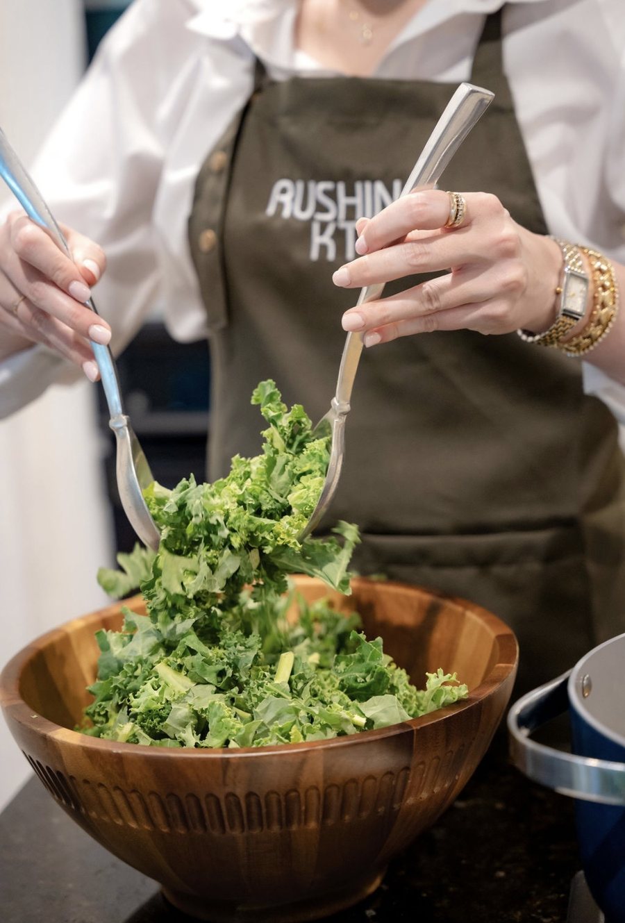 Chef Alex tossing a fresh kale salad